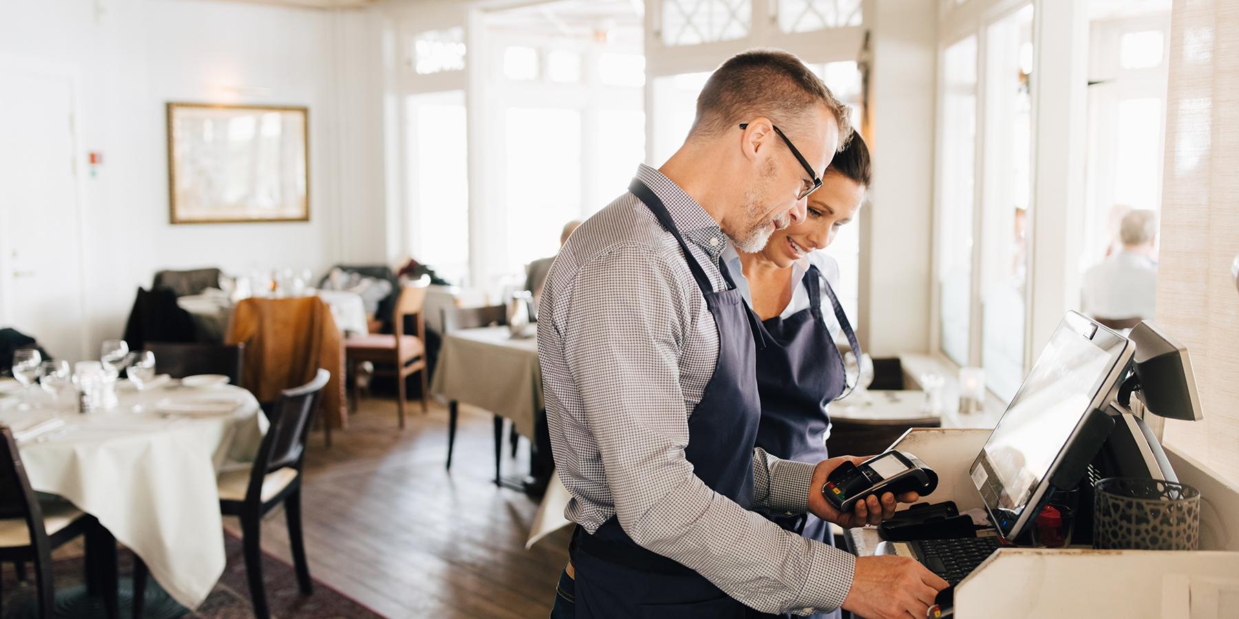 Employees of restaurant working on secure connection from SCS